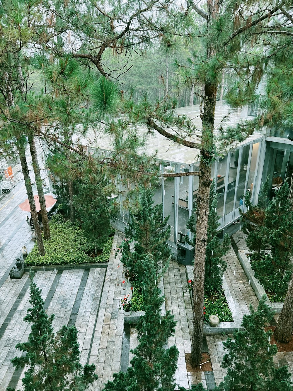 an aerial view of a house surrounded by trees