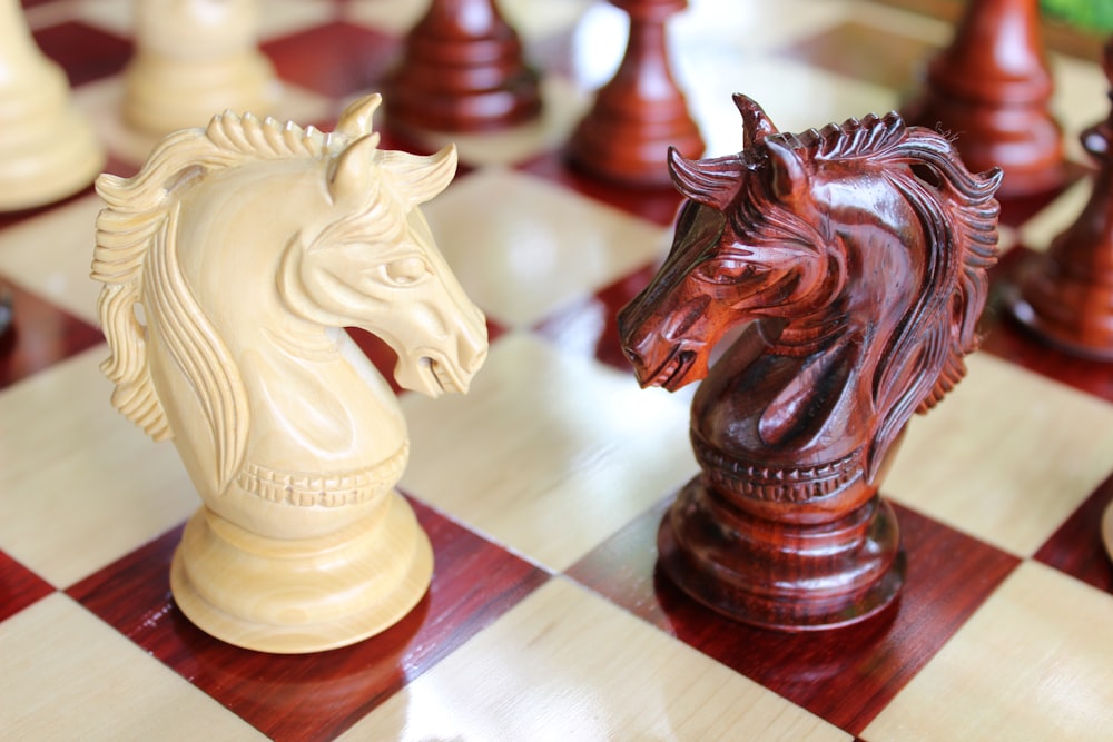 a close up of a chess board with a horse head on it