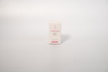 A small rectangular box with a white background, displaying text related to acne treatment. The box has pink text on the front that includes the words 'Treatment Acne'. The surface is smooth and the background is a neutral, light cream color.