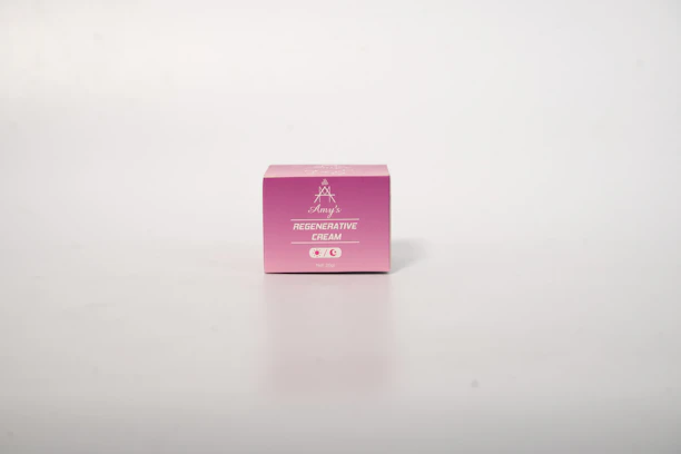 Close-up of hands gently opening a package labeled 'armonnie' with regenerative medicine products inside.