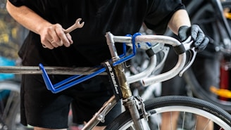 a close up of a person holding a bike