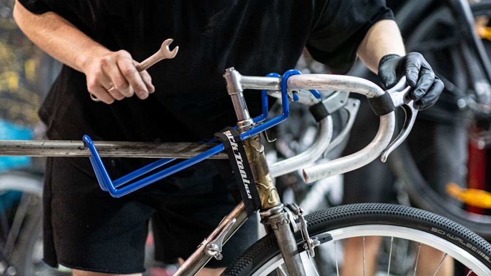a close up of a person holding a bike