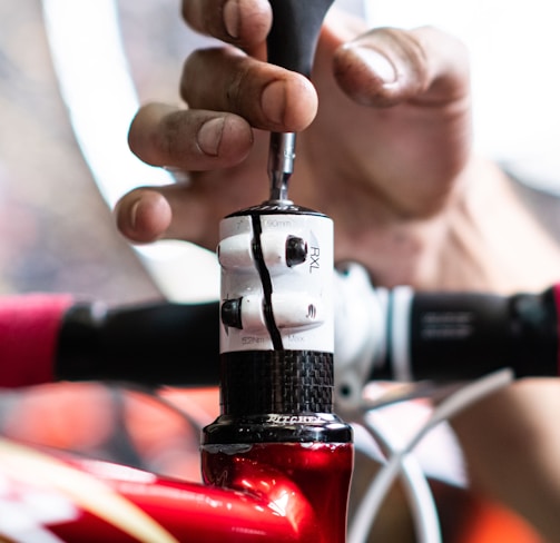 a close up of a person holding a bike handle