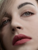 A close-up of beautifully shaped brows showcasing permanent makeup.