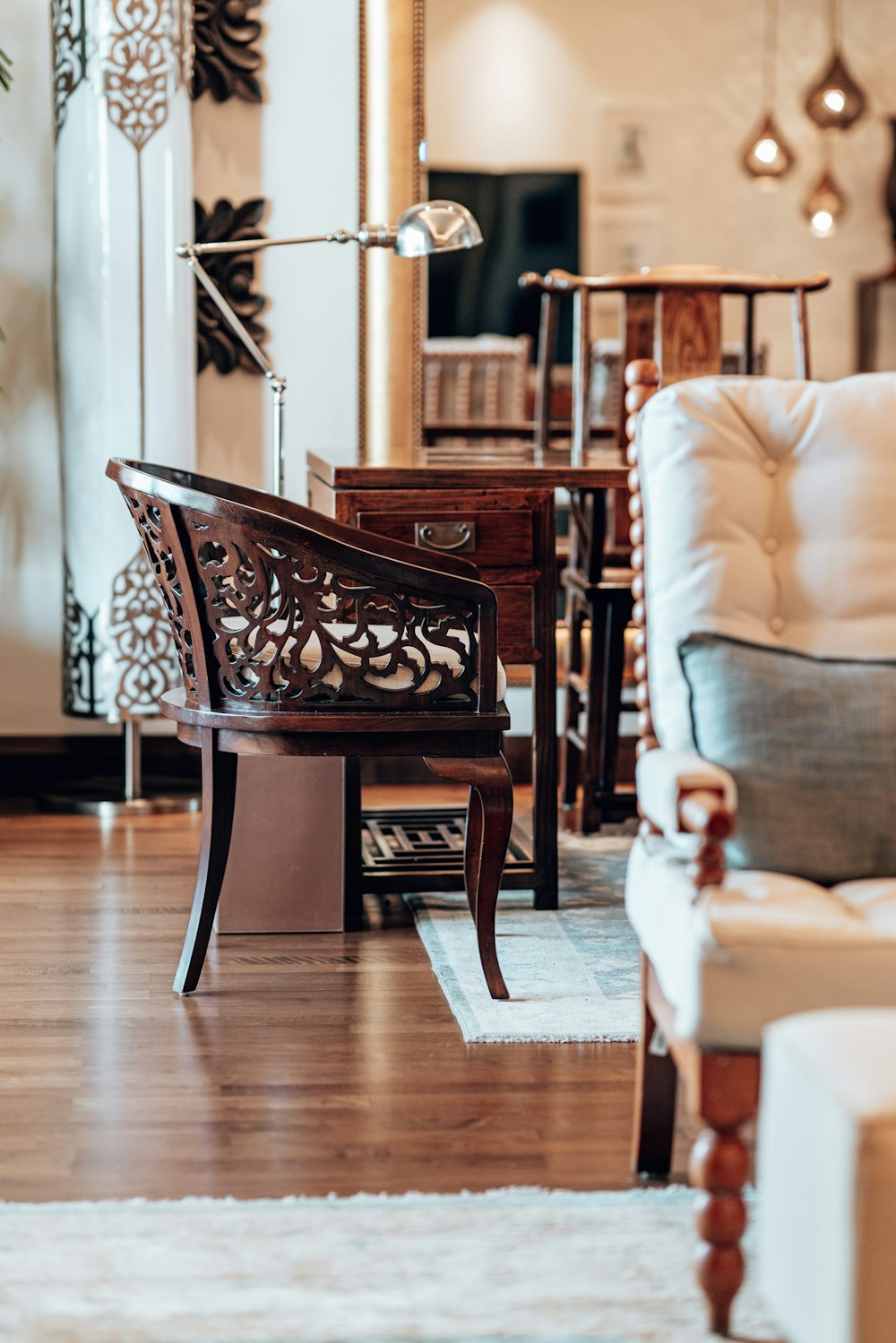 a living room filled with furniture and a mirror