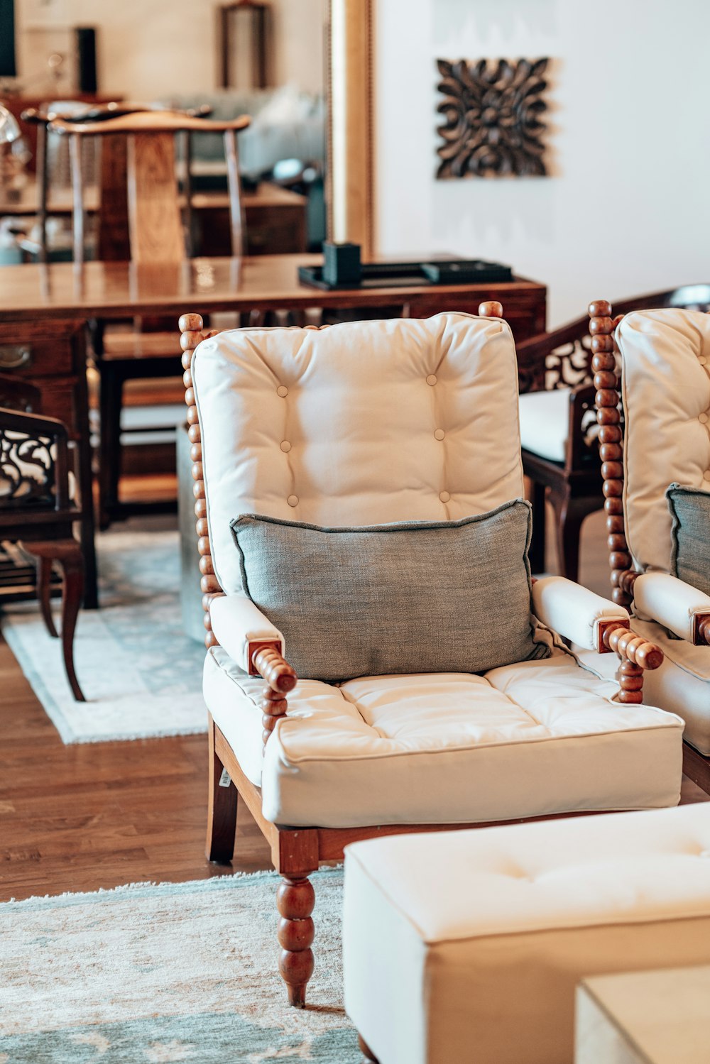 a living room with two chairs and a table