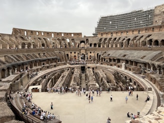 a group of people standing inside of a stone building