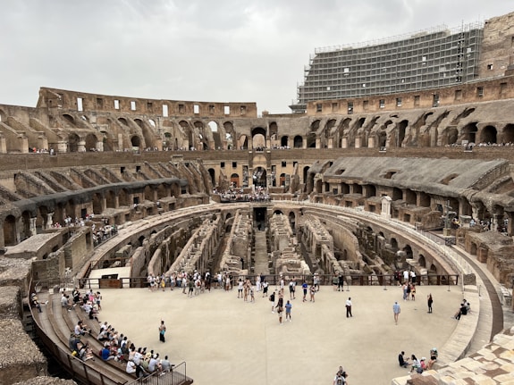 a group of people standing inside of a stone building