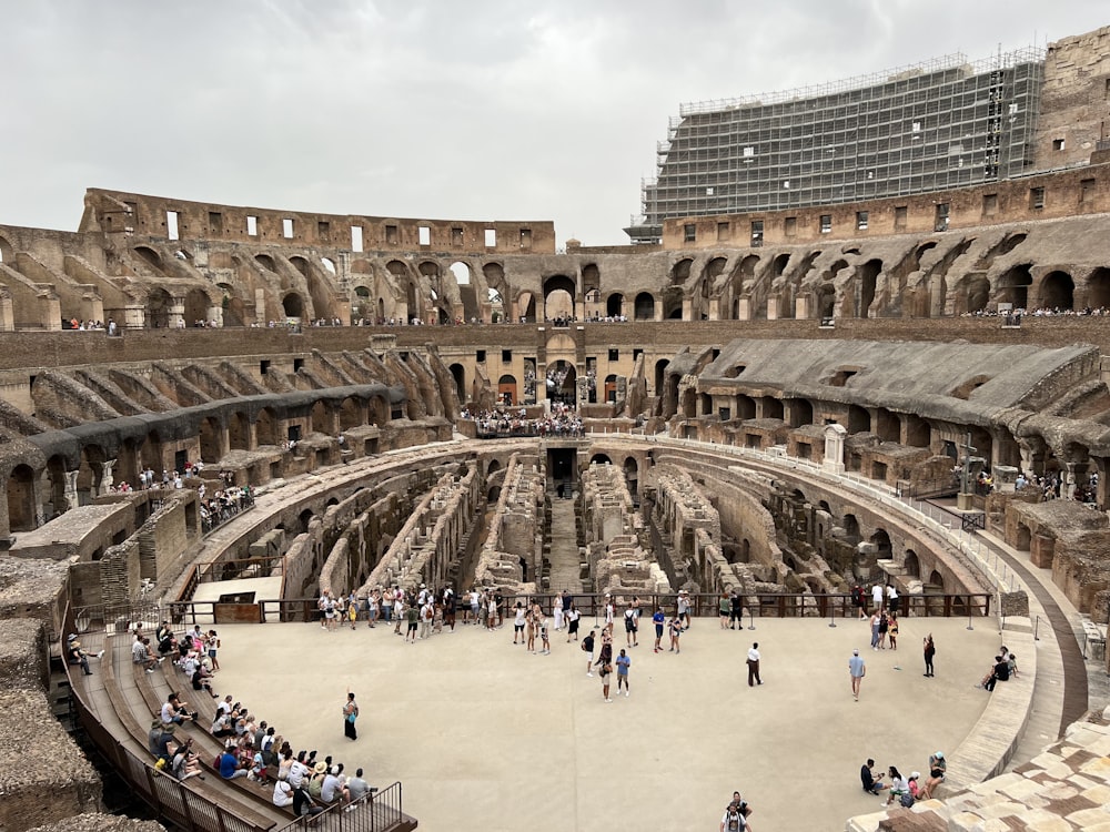 a group of people standing inside of a stone building