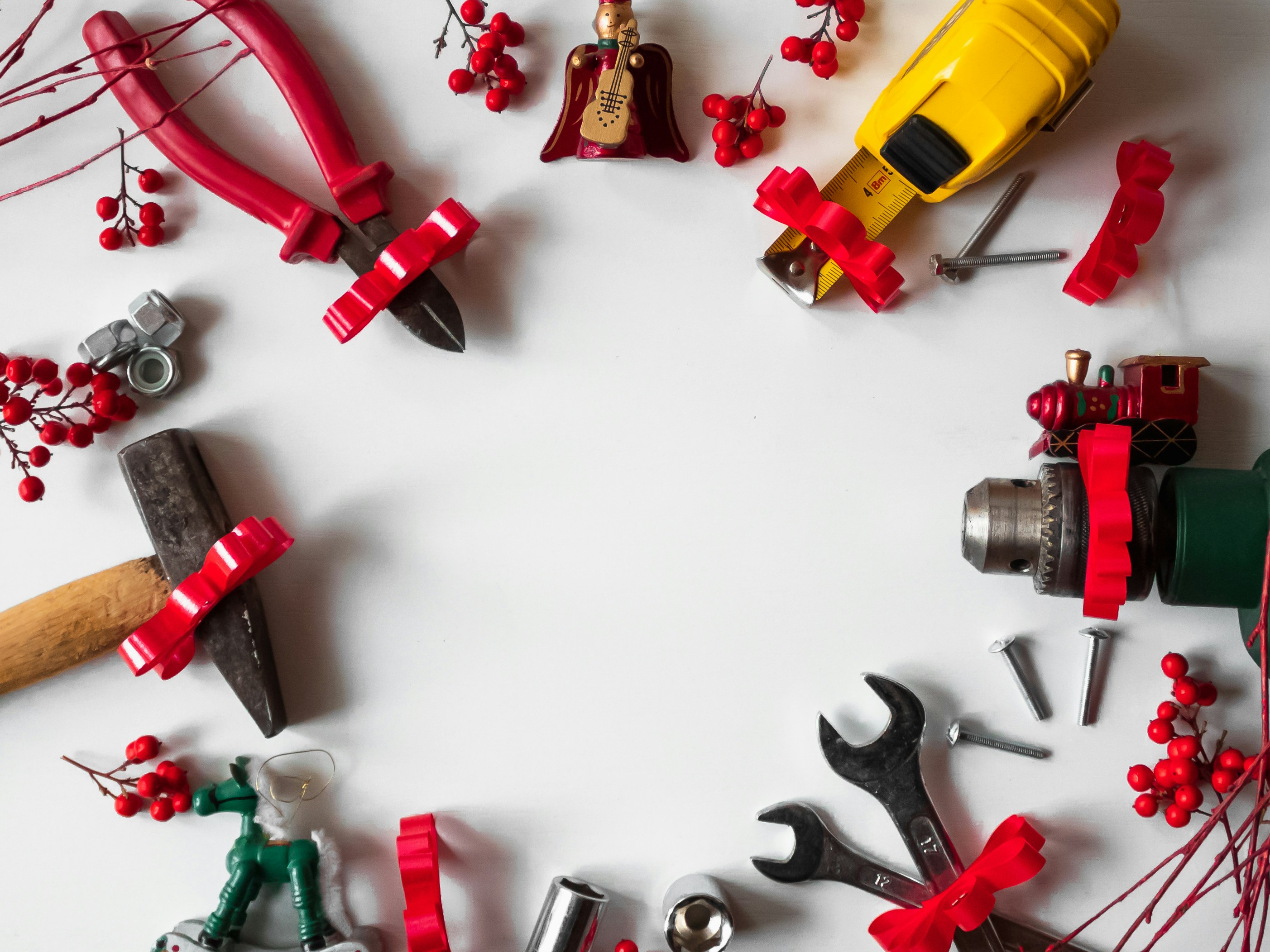 Working tools with Christmas decorations and white background