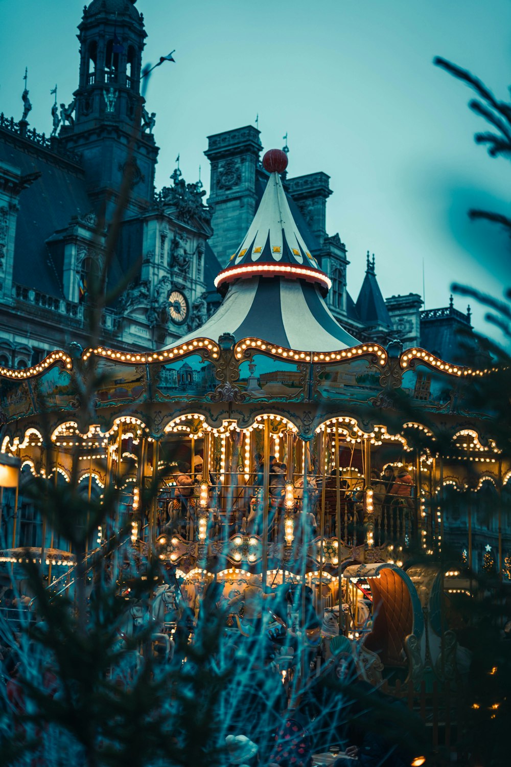 a merry go round in front of a large building