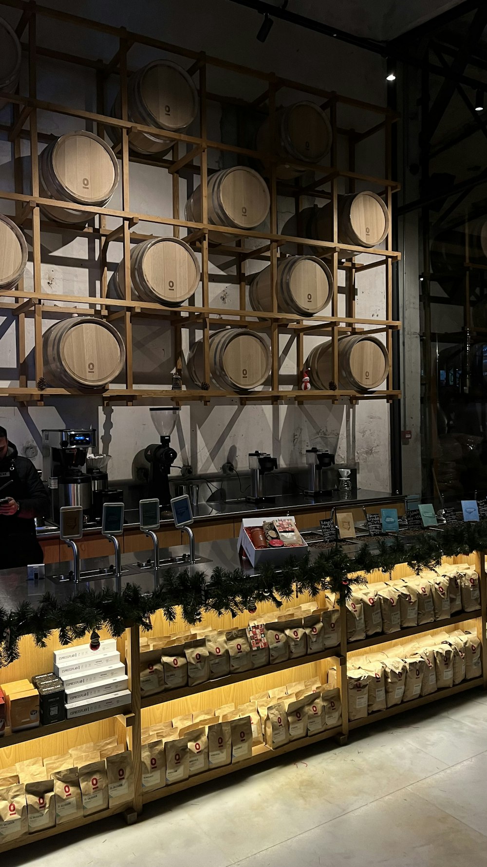 a store filled with lots of wooden barrels