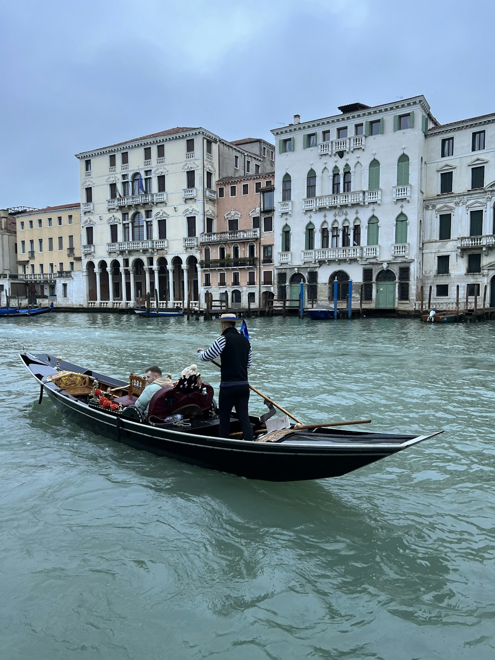 a man standing on a boat in the water