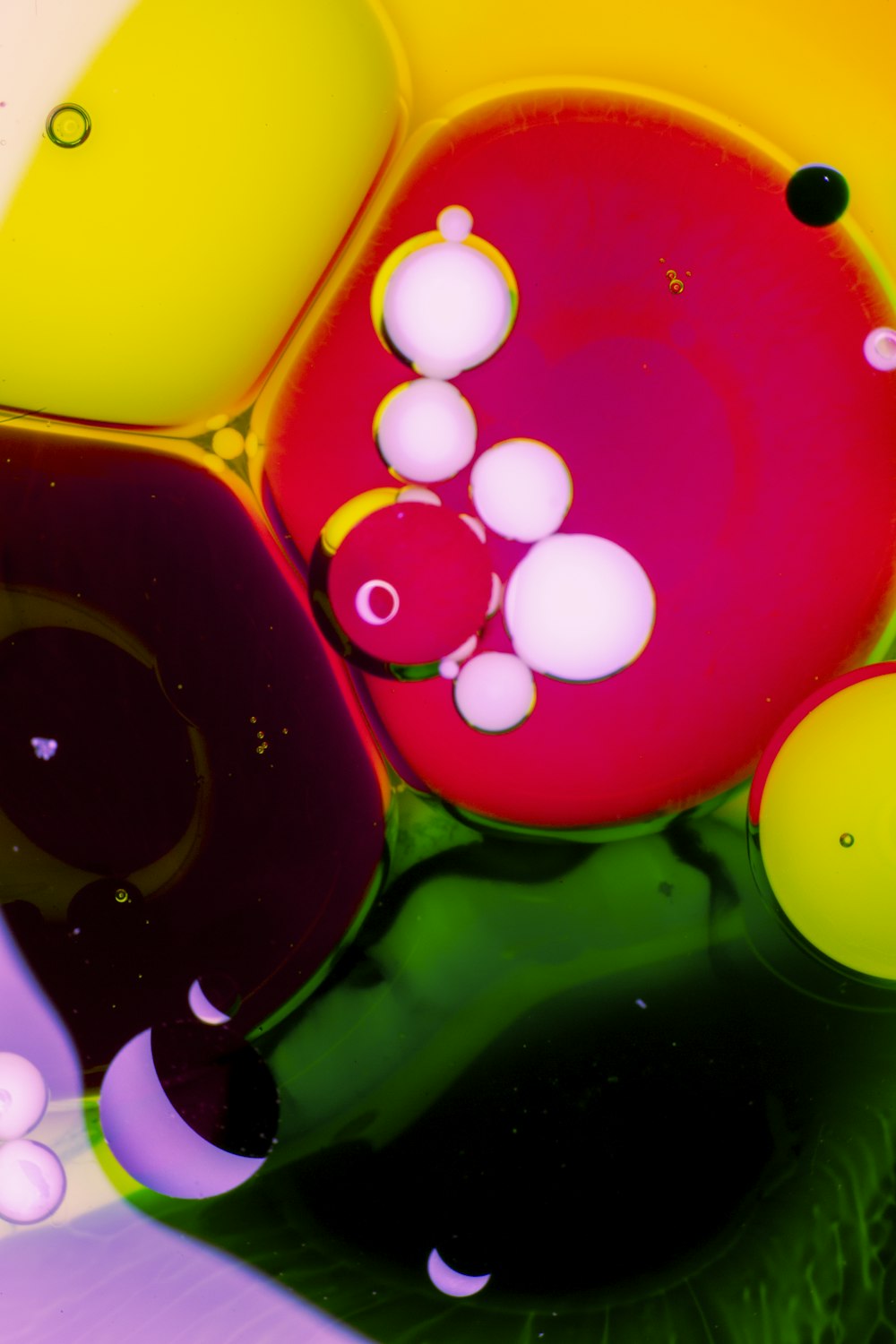 a close up of a multicolored object with bubbles