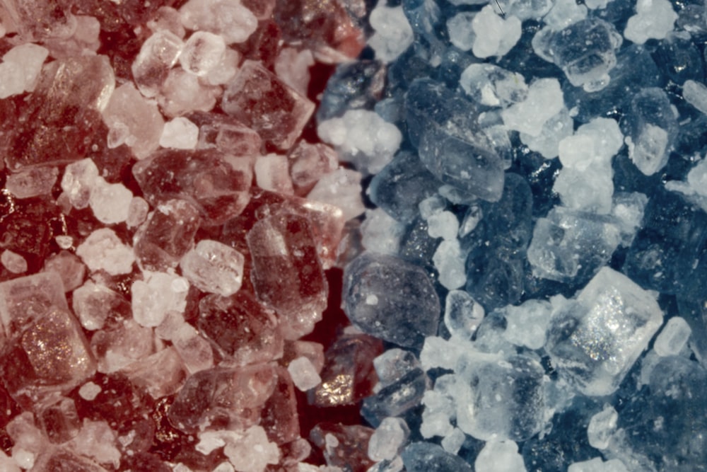 two different colored pieces of ice next to each other