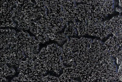 a close up of the surface of a black surface