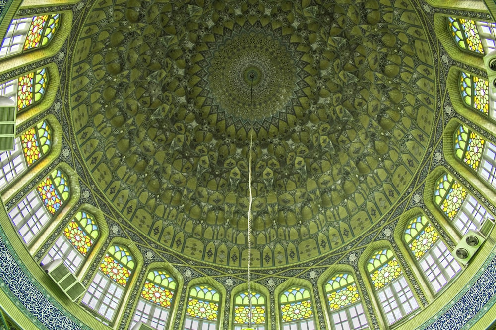 the ceiling of a building with many windows