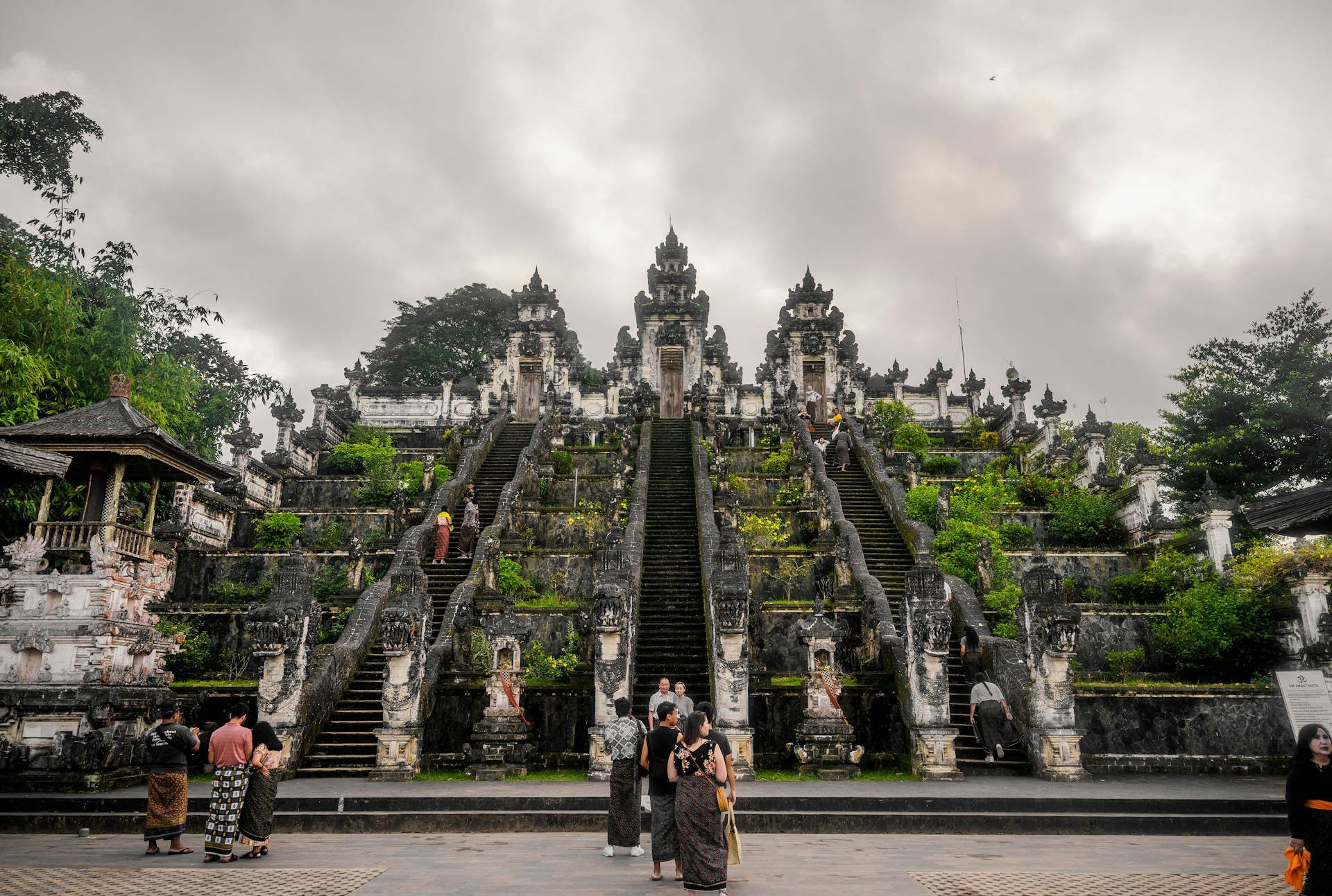 a group of people standing in front of a large building
