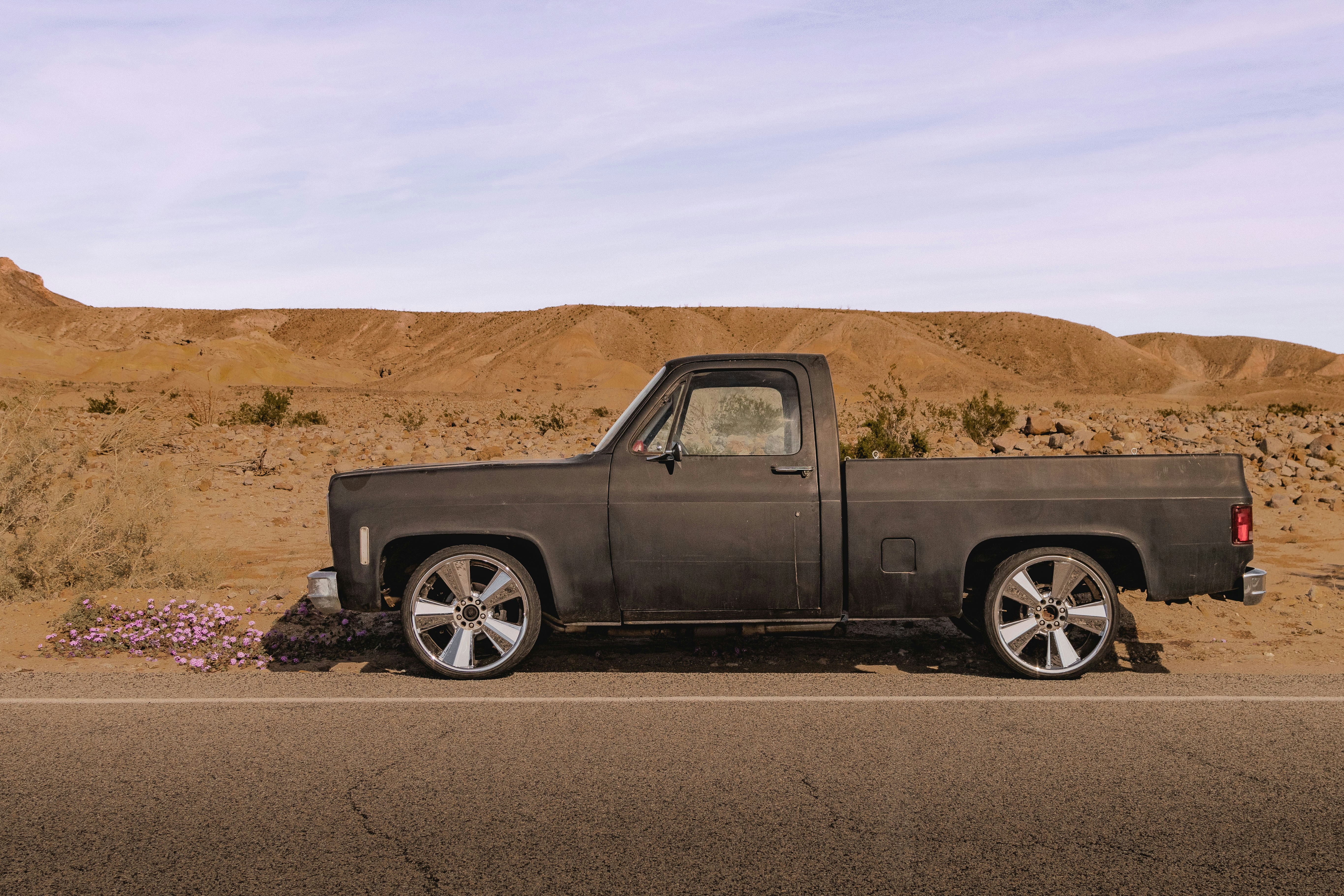 a truck parked on the side of the road (Photo by Parker Sturdivant on Unsplash)