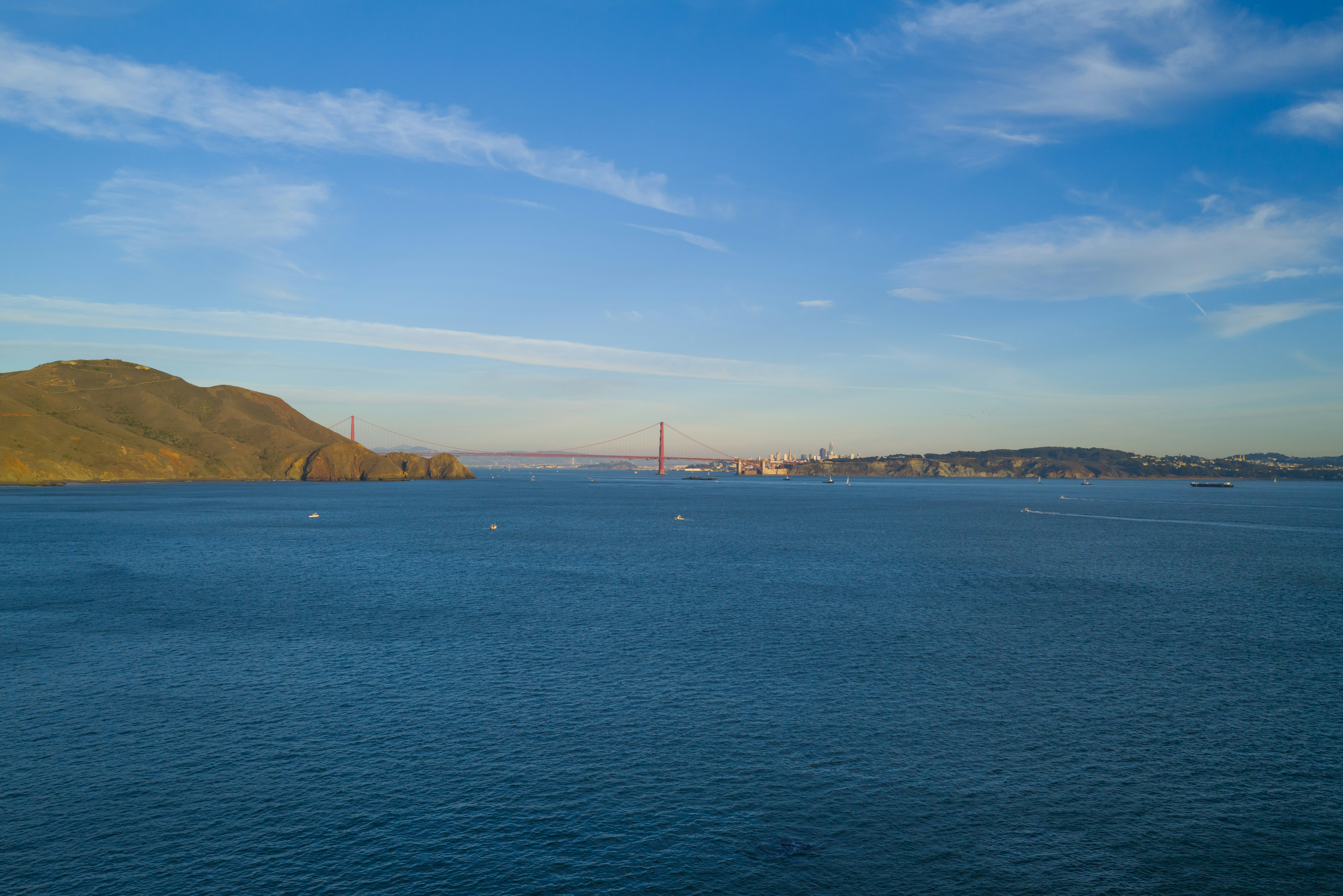 a large body of water with a bridge in the background, Golden Gate Bridge