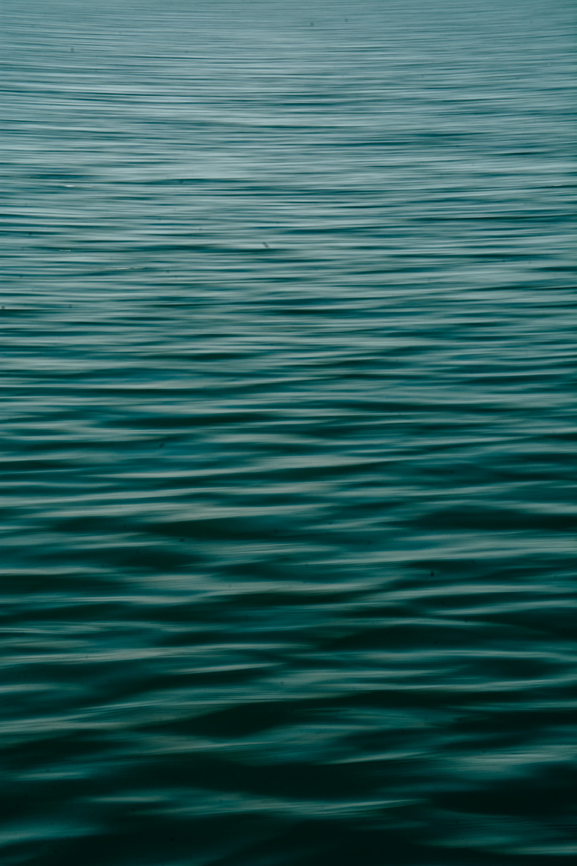 a boat floating on top of a large body of water