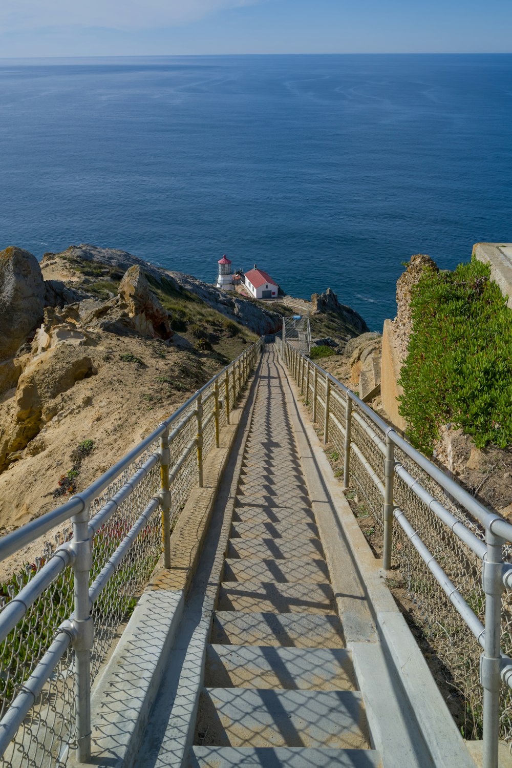 a set of stairs leading down to the ocean