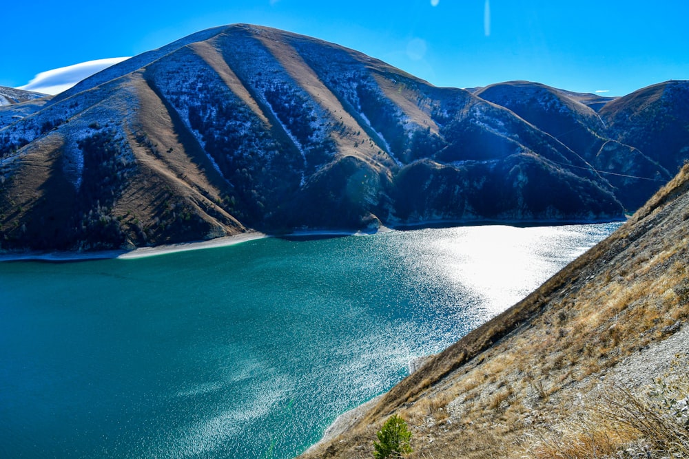 a view of a mountain lake from a cliff