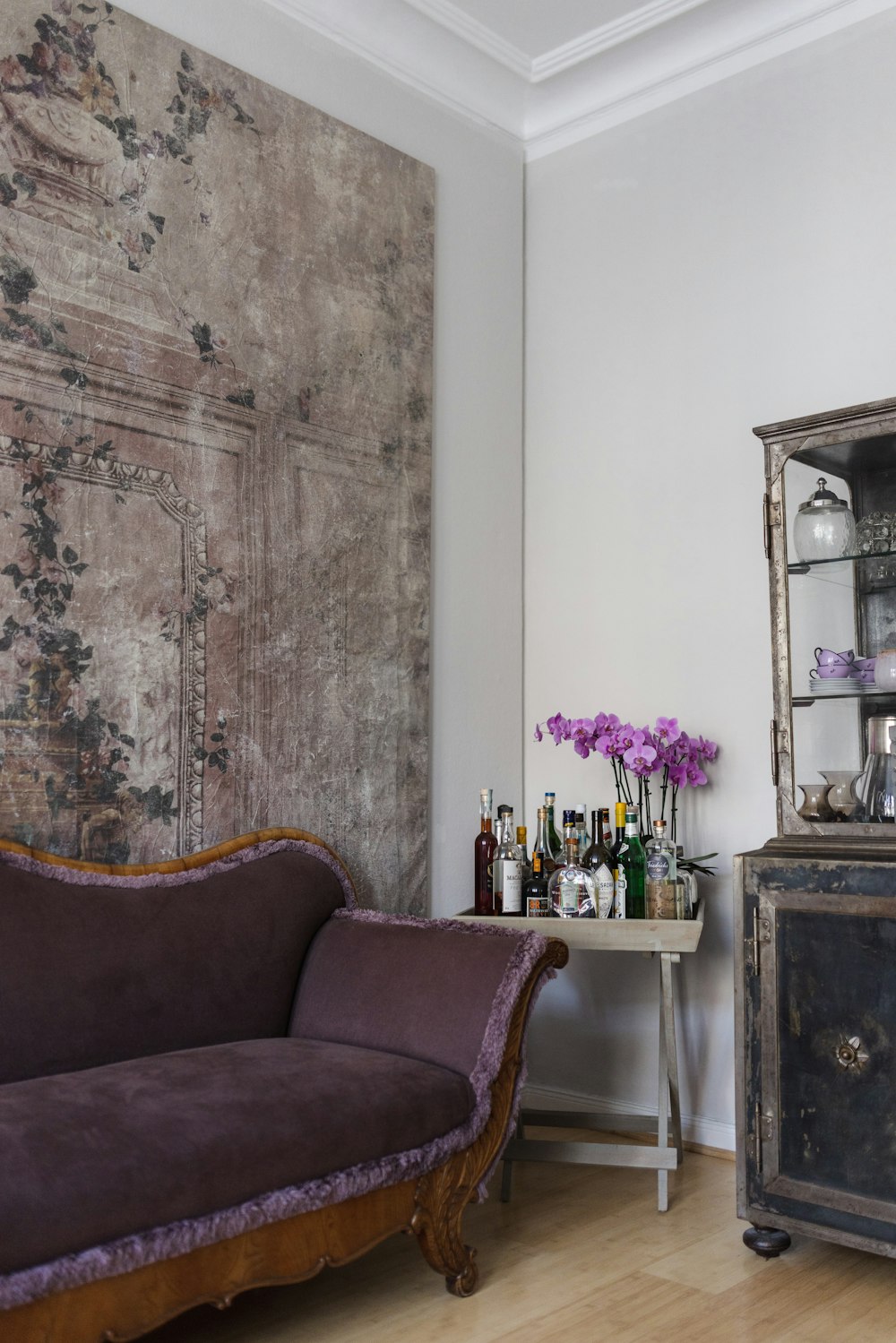 a living room with a couch and a cabinet