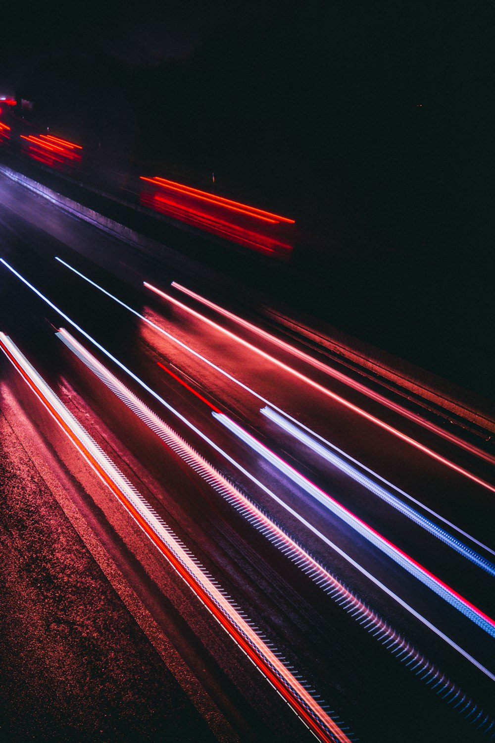 a blurry photo of a city street at night