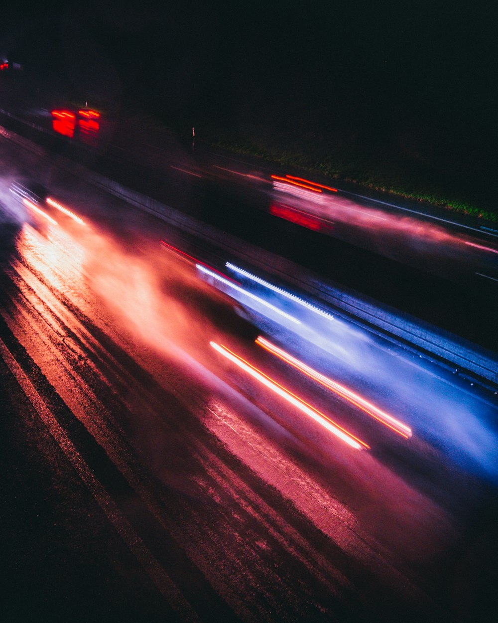 a blurry photo of a city street at night