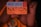 A hand is holding a card with text that reads 'we are NATION'. The card includes a red square symbol and additional text 'Empower Africa.' and a URL 'nation.africa'. The background features an orange and dark pattern.