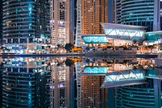 a city at night with a lot of tall buildings