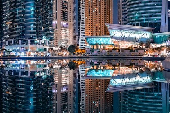 a city at night with a lot of tall buildings