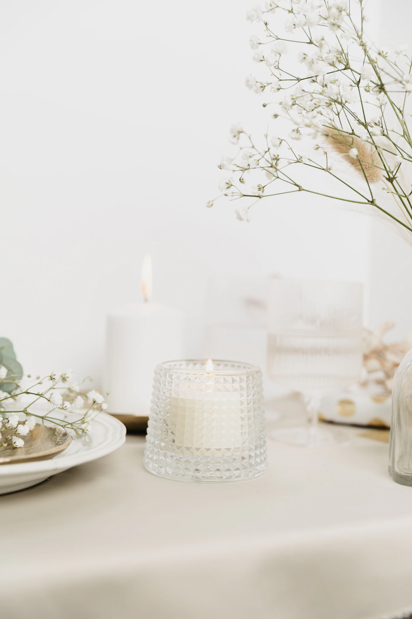 Candles and fresh flowers styled on an elegant table