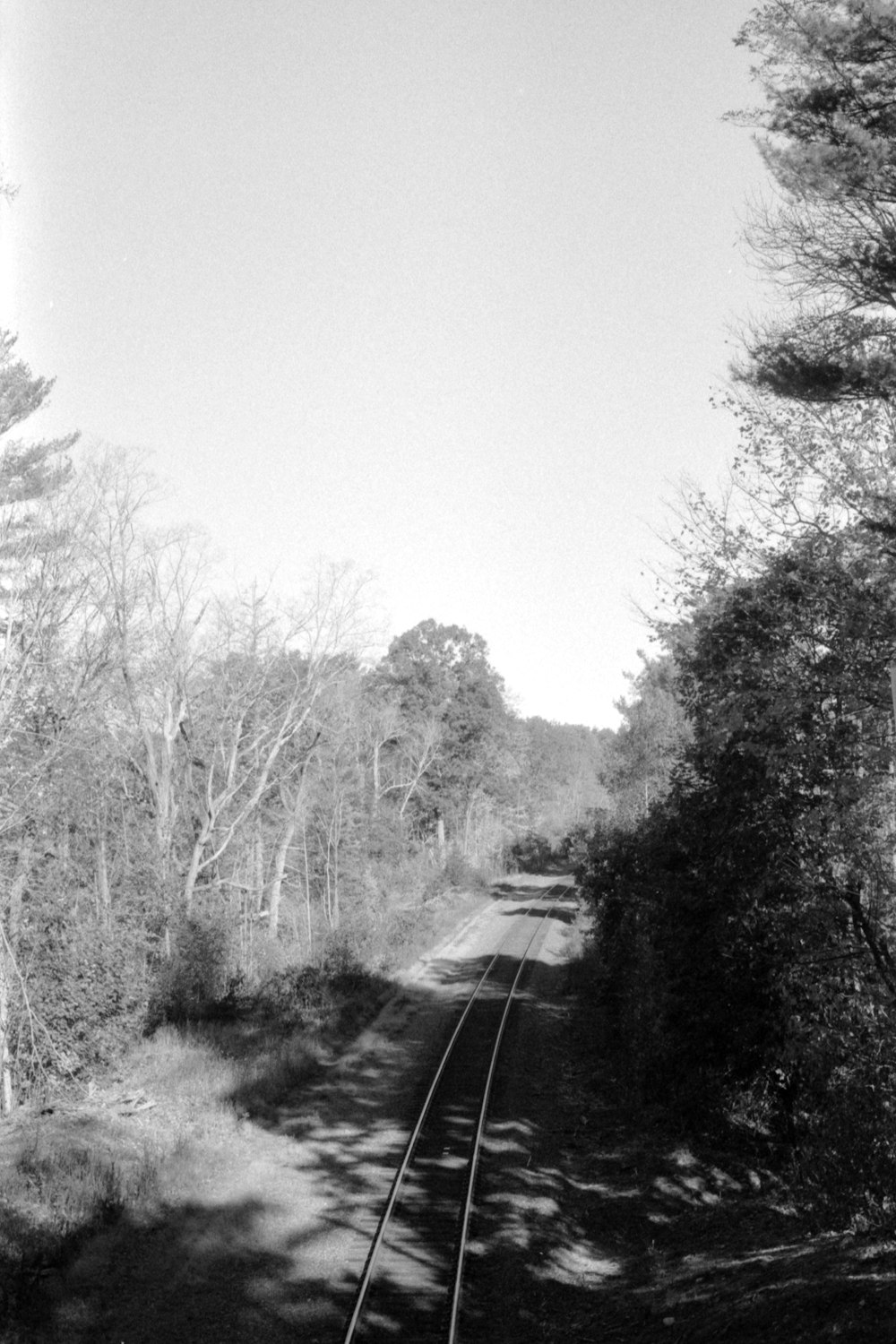 a black and white photo of a train track