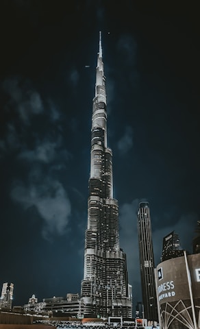 a very tall building towering over a city