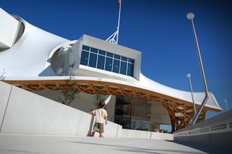 a man is walking outside of a building