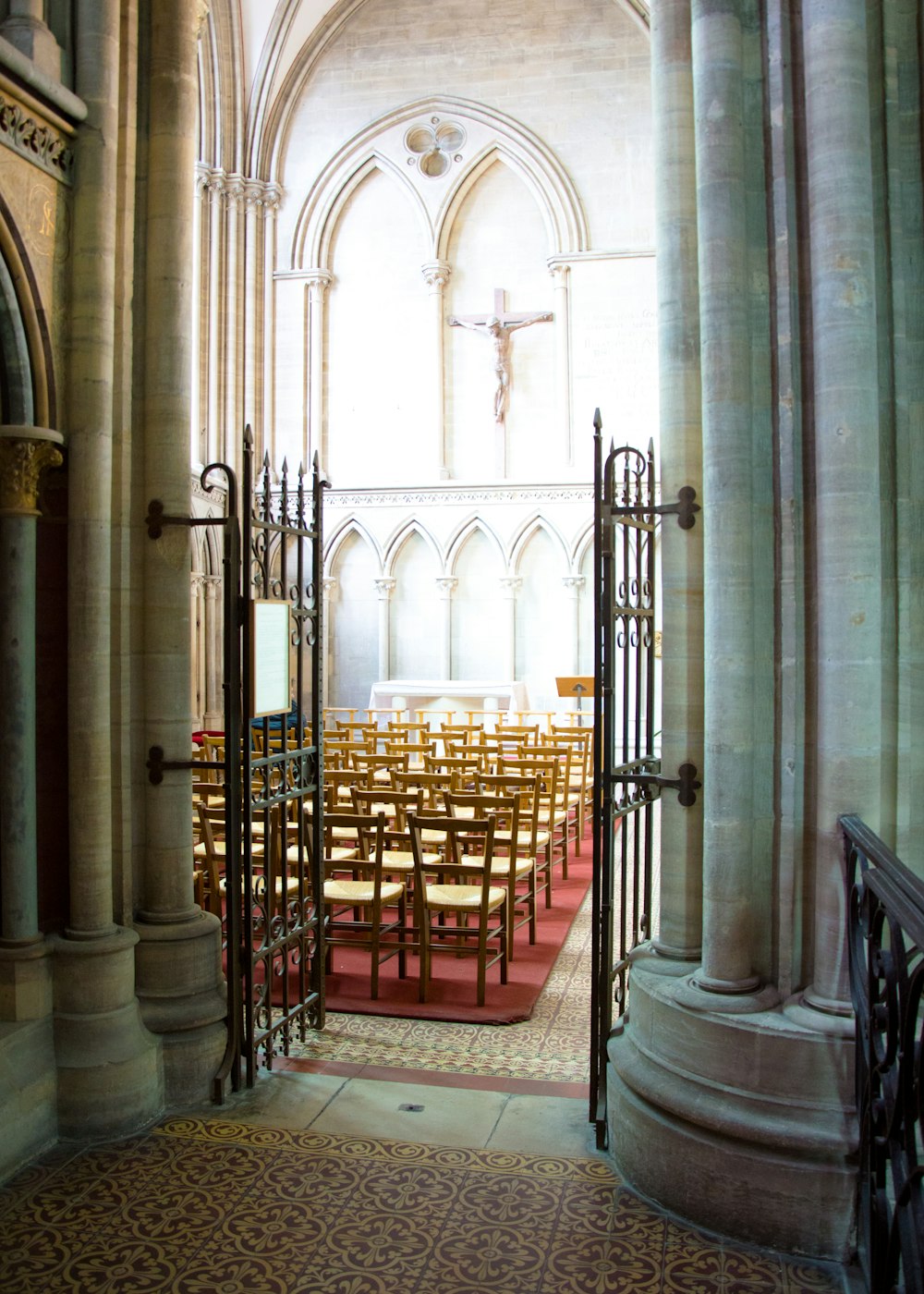 a church filled with lots of wooden chairs