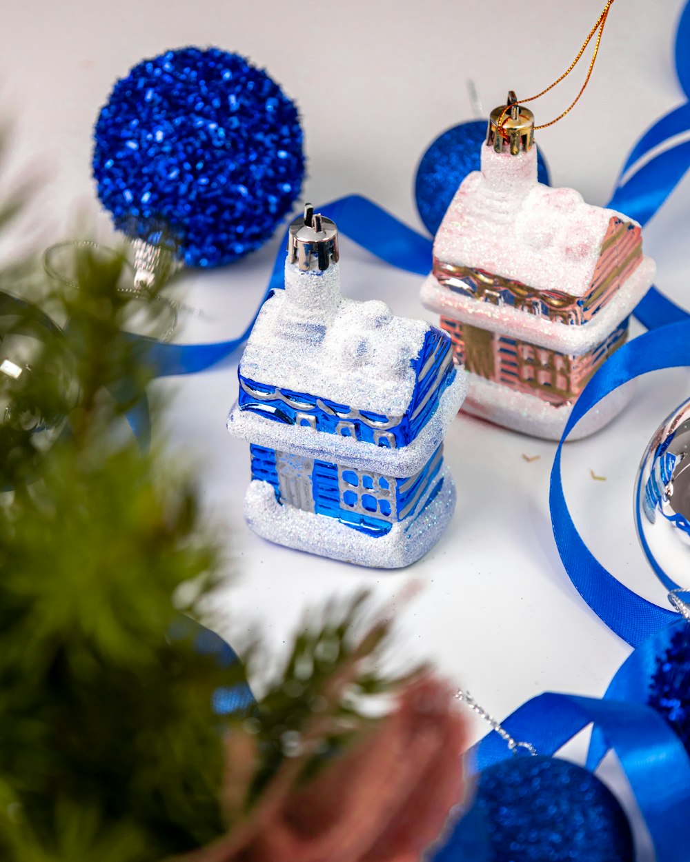 a table topped with blue and white ornaments
