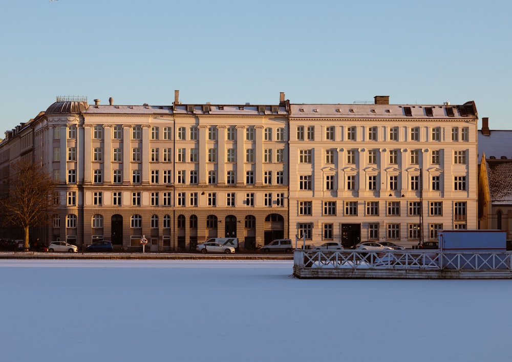 a large building sitting on top of a snow covered field