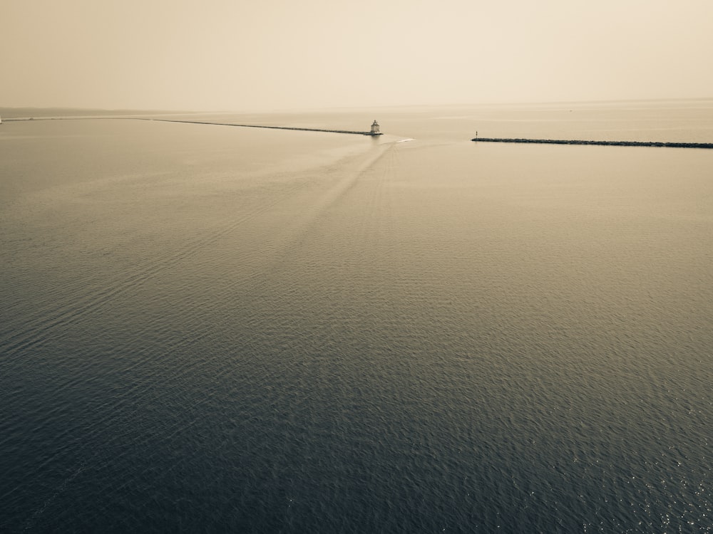 a boat traveling across a large body of water