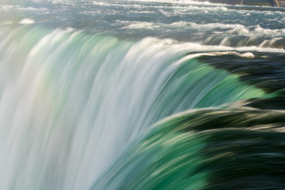 a large waterfall with water flowing over it