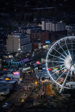 an aerial view of a ferris wheel at night