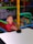 A therapist working with a child in a bright, engaging environment.