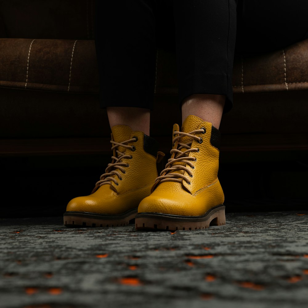 a close up of a person wearing yellow boots