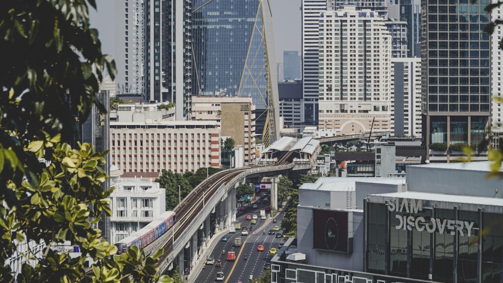 a view of a city with a train on the tracks