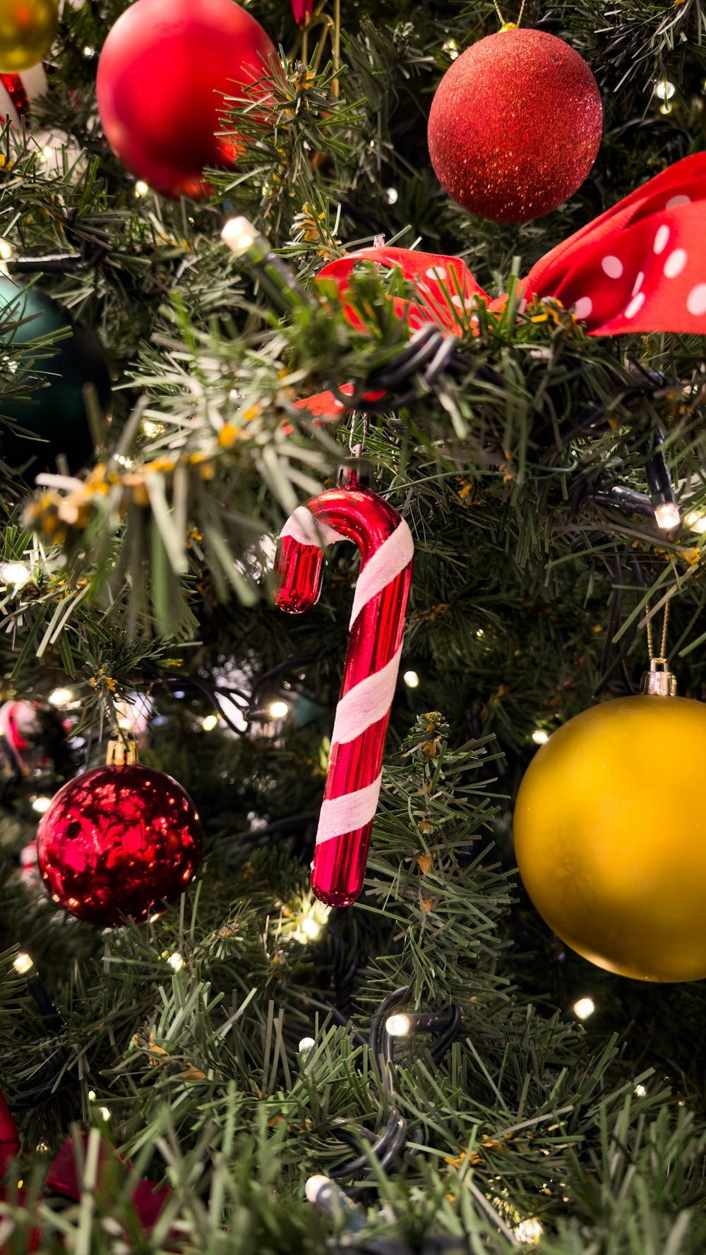 a christmas tree with ornaments and a candy cane