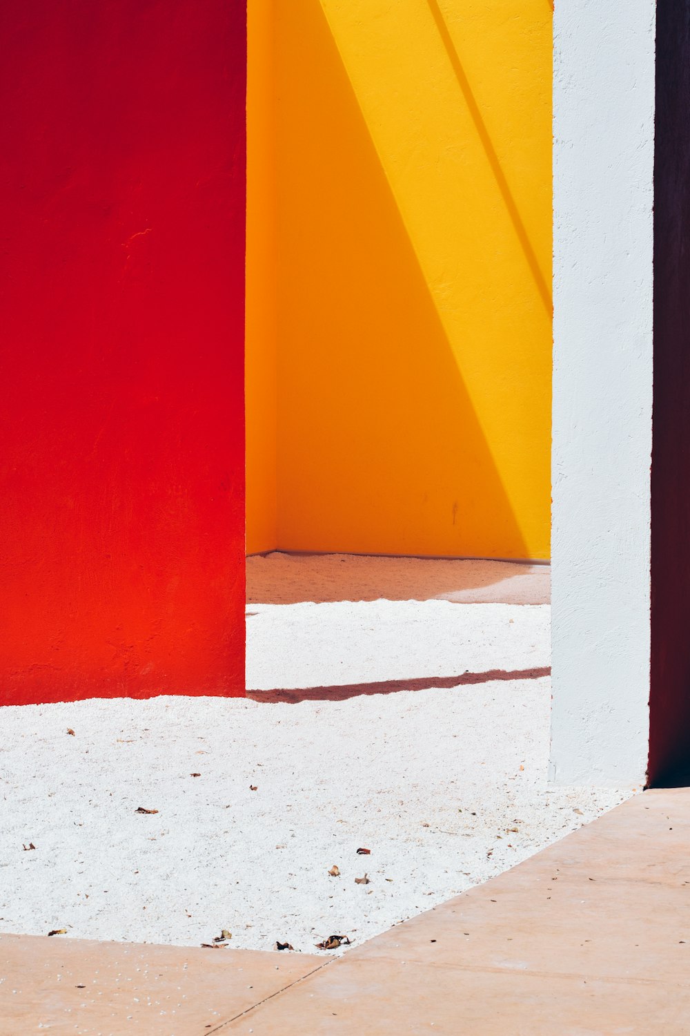 a red and yellow wall and a white and red wall