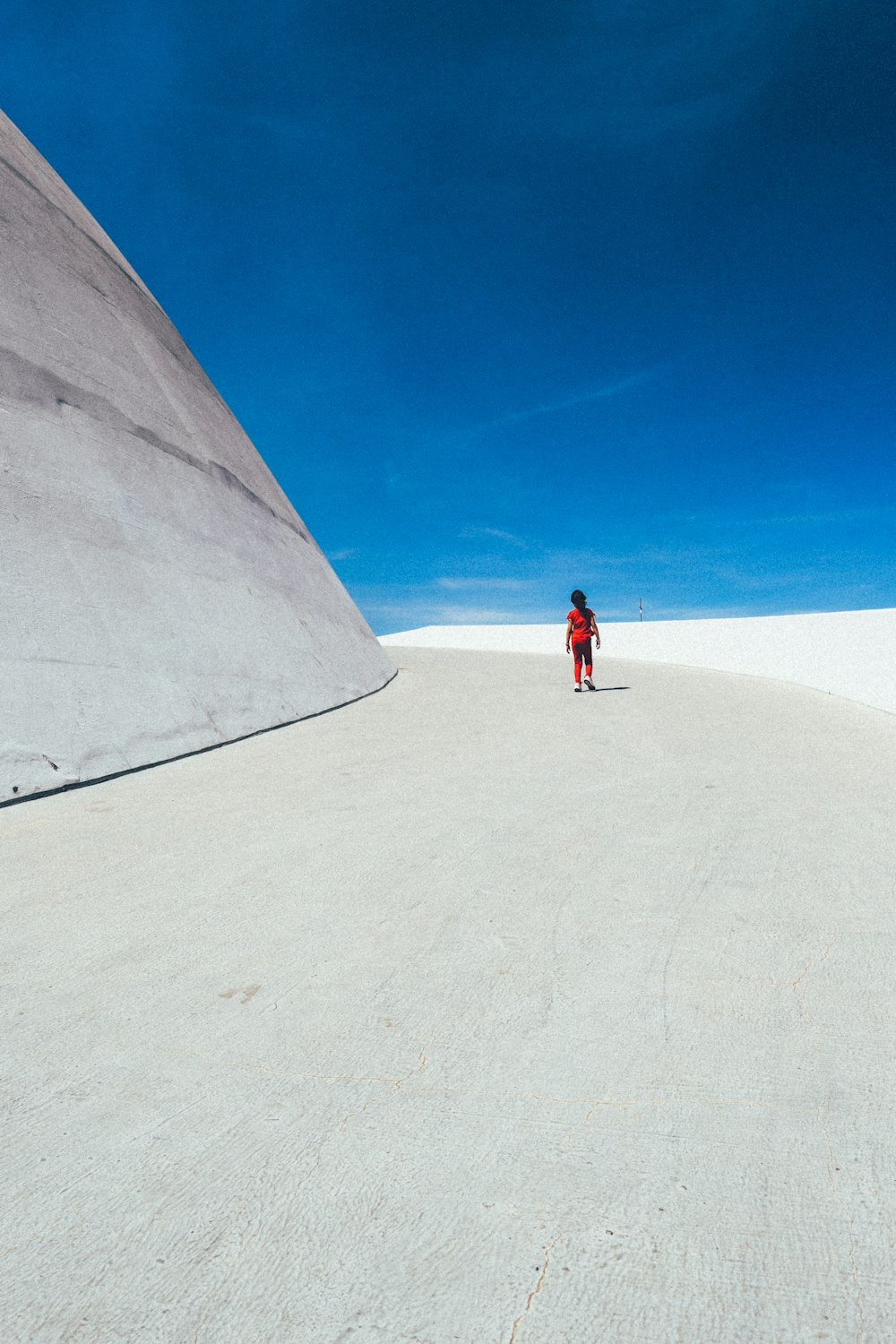 a person standing in the middle of a desert