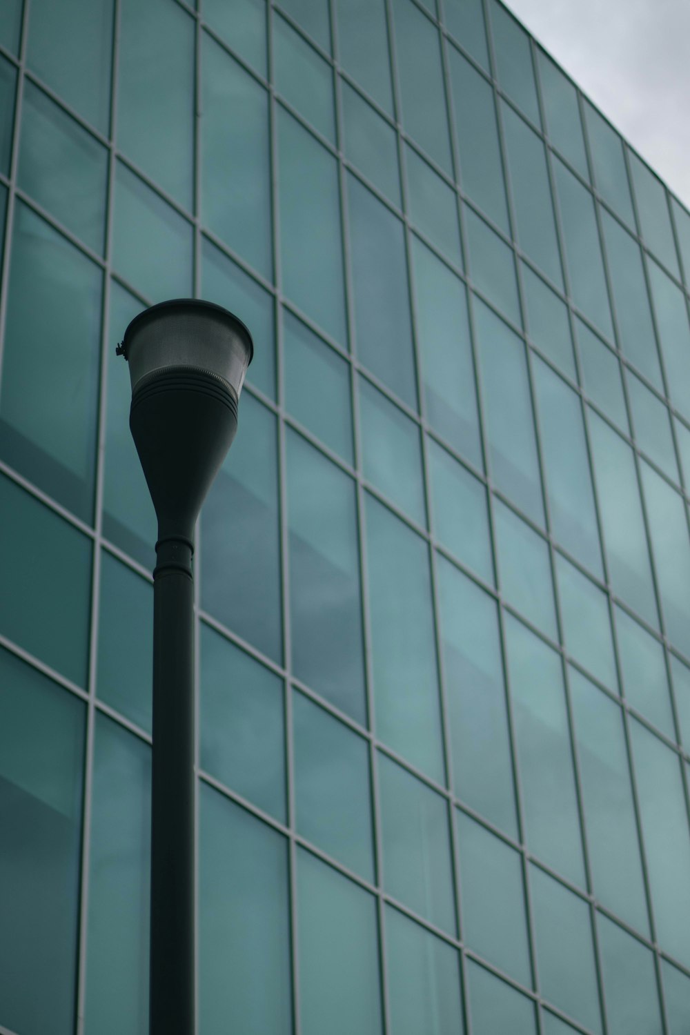 a street light in front of a tall building